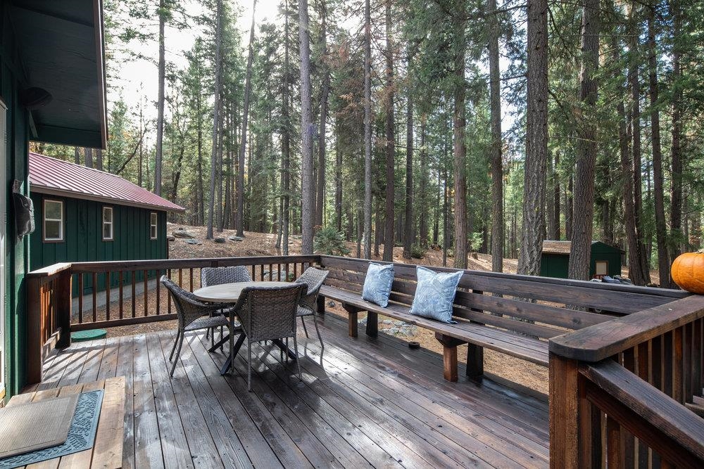 58882 Little Long Valley Creek Road Cromberg, CA 96103 - Photo 4 of 28 a view of a roof deck with table and chairs with wooden floor and fence
