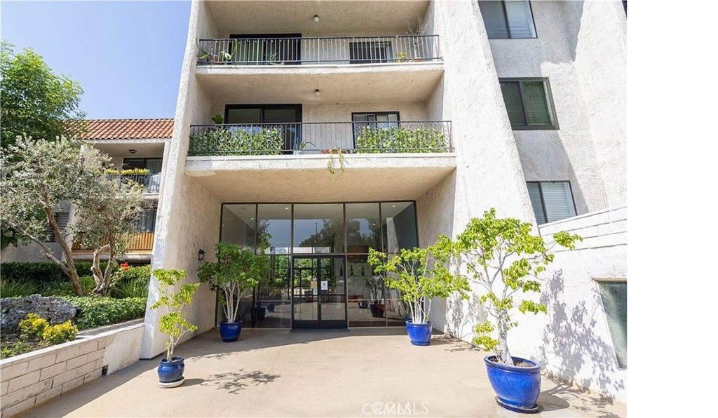 1401 Valley View Road, Unit 325 Glendale, CA 91202 - Photo 1 of 1 a front view of a house with potted plants