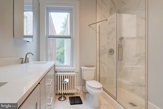 726 3rd Street Northeast Washington, DC 20002 - Photo 12 of 41 a bathroom with a sink a toilet and shower