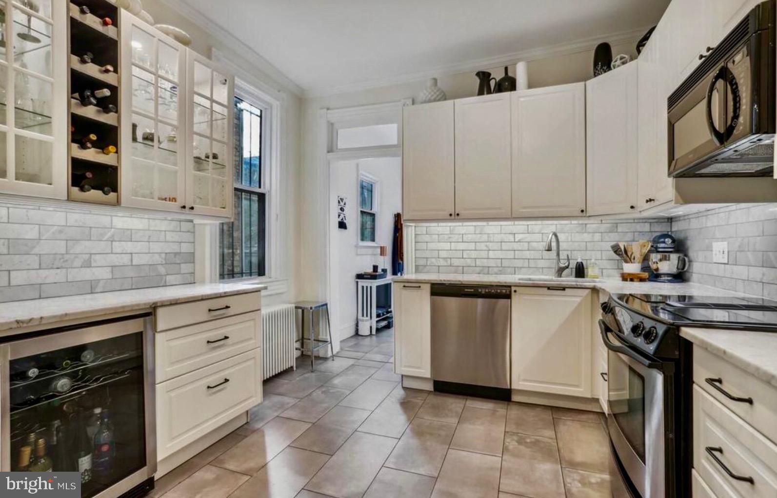 726 3rd Street Northeast Washington, DC 20002 - Photo 20 of 41 a kitchen with cabinets appliances and a counter