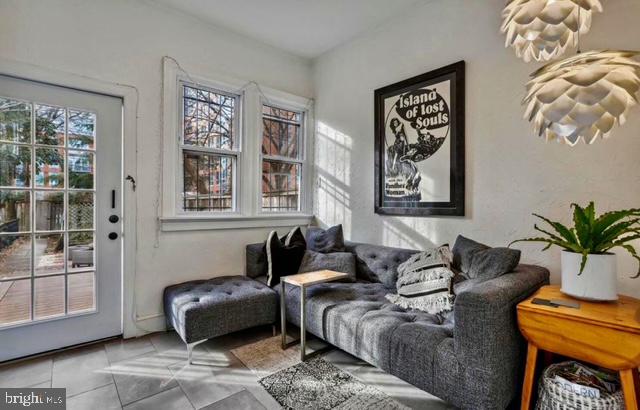 726 3rd Street Northeast Washington, DC 20002 - Photo 22 of 41 a living room with furniture and a window