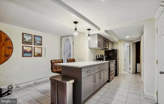 a kitchen with a sink a stove a refrigerator and cabinets