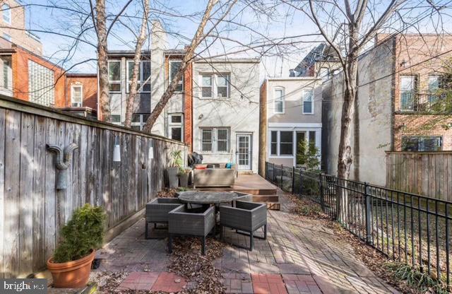 726 3rd Street Northeast Washington, DC 20002 - Photo 41 of 41 a view of a patio with couches table and chairs and potted plants