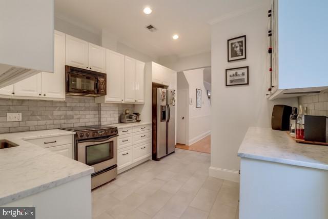 726 3rd Street Northeast Washington, DC 20002 - Photo 5 of 41 a kitchen with stainless steel appliances granite countertop a refrigerator stove and sink