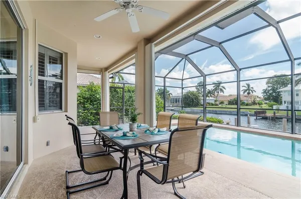 a dining room with furniture window and outside view