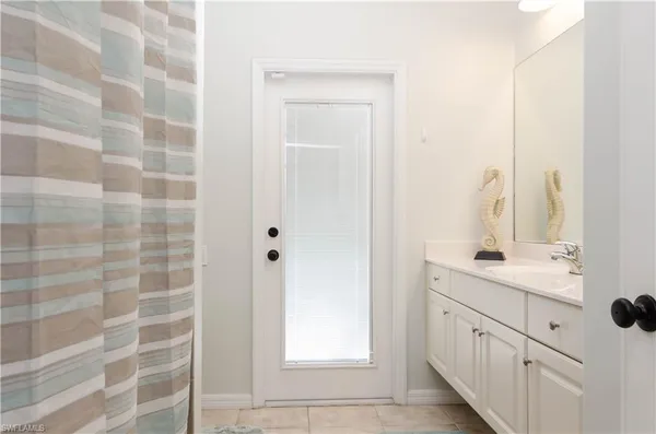 a bathroom with a double vanity sink a mirror and