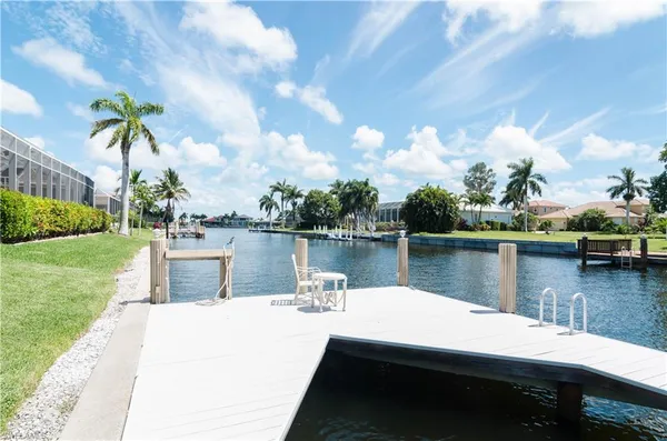 a view of a lake with a house in the background