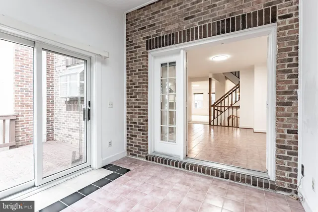 a view of livingroom with floor to ceiling window