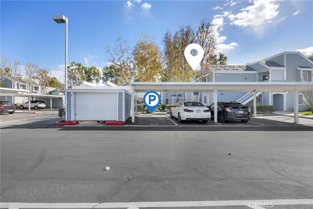 an aerial view of residential houses with outdoor space and swimming pool