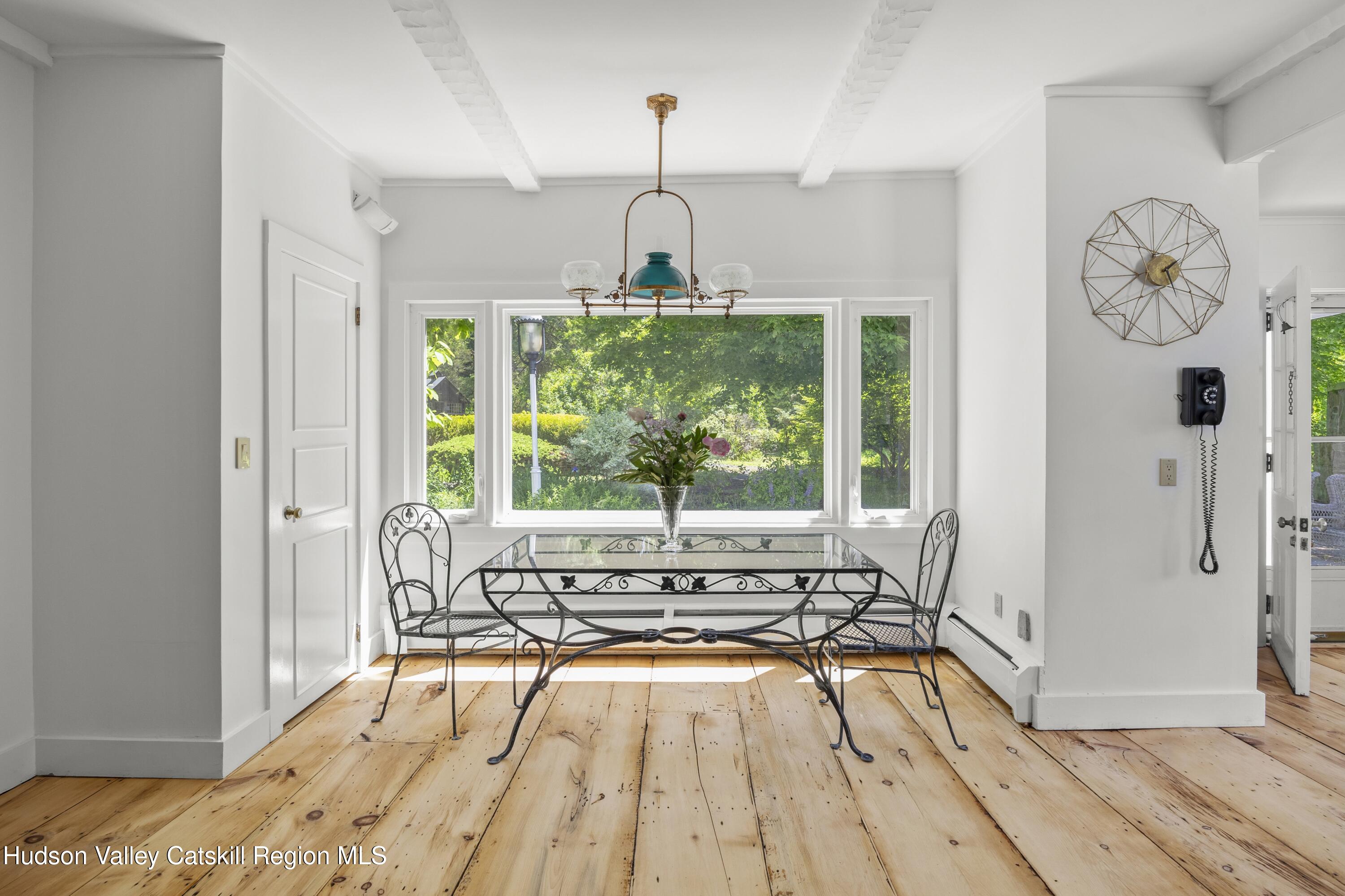 202 Buckwheat Bridge Road Germantown, NY 12526 - Photo 13 of 47 a spacious bedroom with a bed and a window
