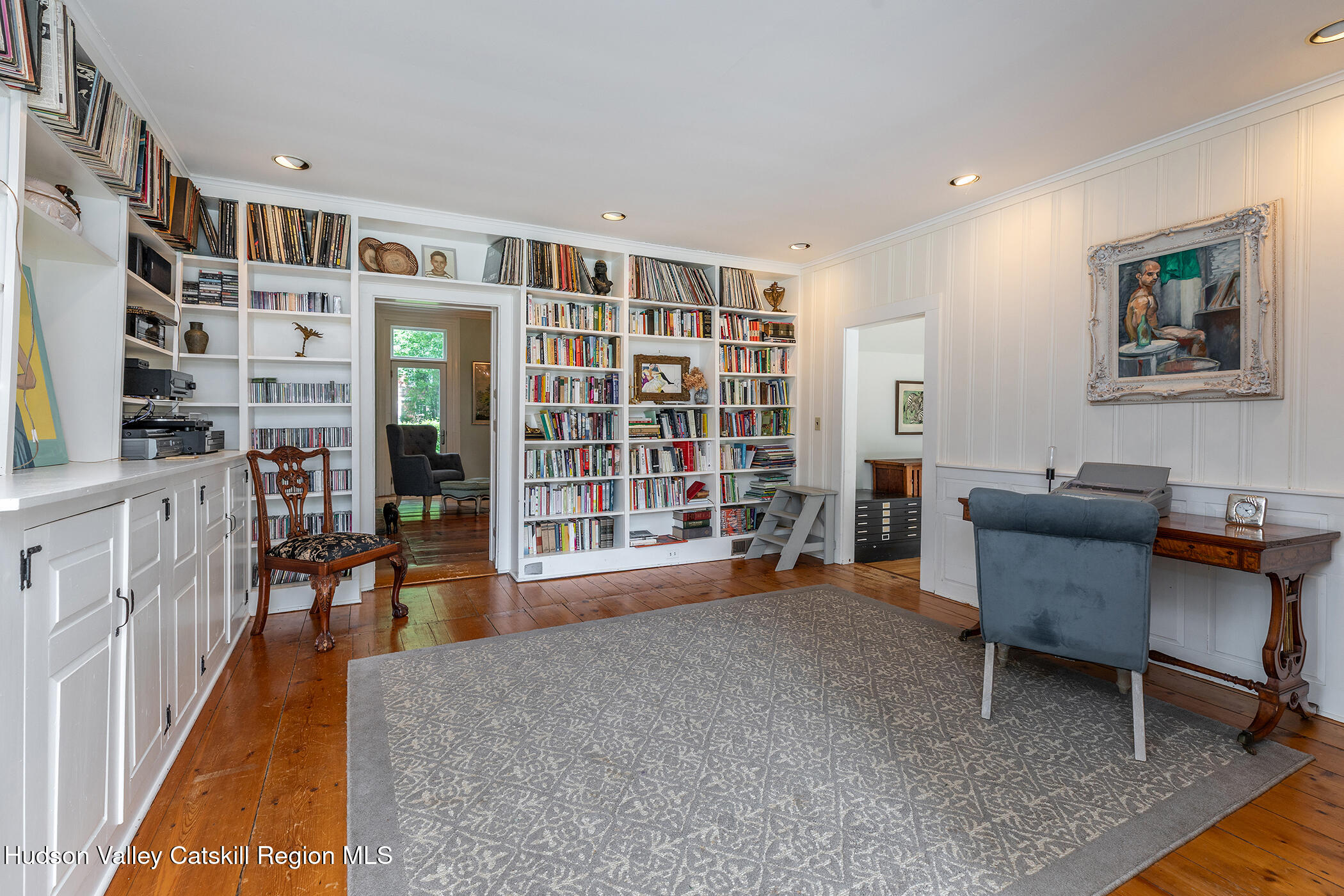 202 Buckwheat Bridge Road Germantown, NY 12526 - Photo 17 of 47 a living room with furniture and a bookshelf