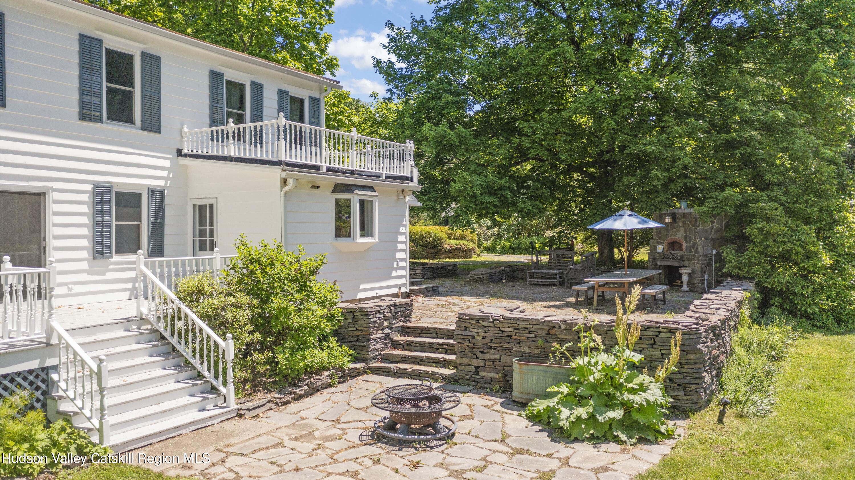 202 Buckwheat Bridge Road Germantown, NY 12526 - Photo 27 of 47 a view of a house with backyard sitting area and garden