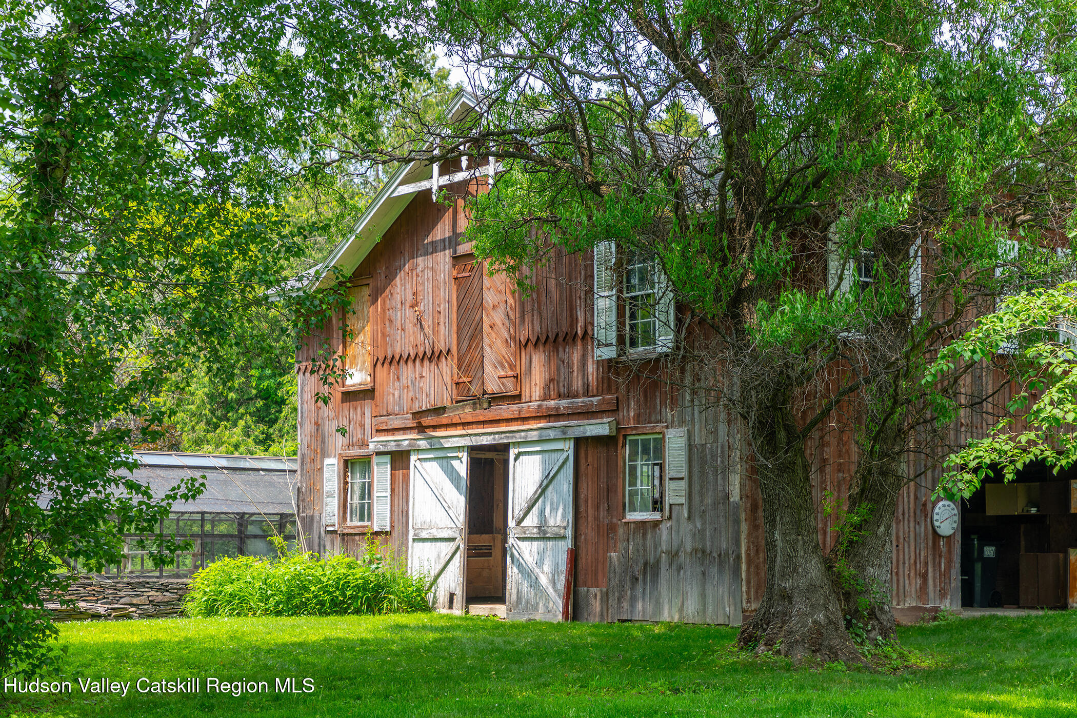 202 Buckwheat Bridge Road Germantown, NY 12526 - Photo 33 of 47 a view of a house with a yard and plants