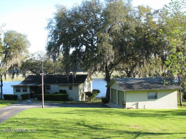6640 Brooklyn Bay Road Keystone Heights, FL 32656 - Photo 1 of 5 a view of a house with a yard