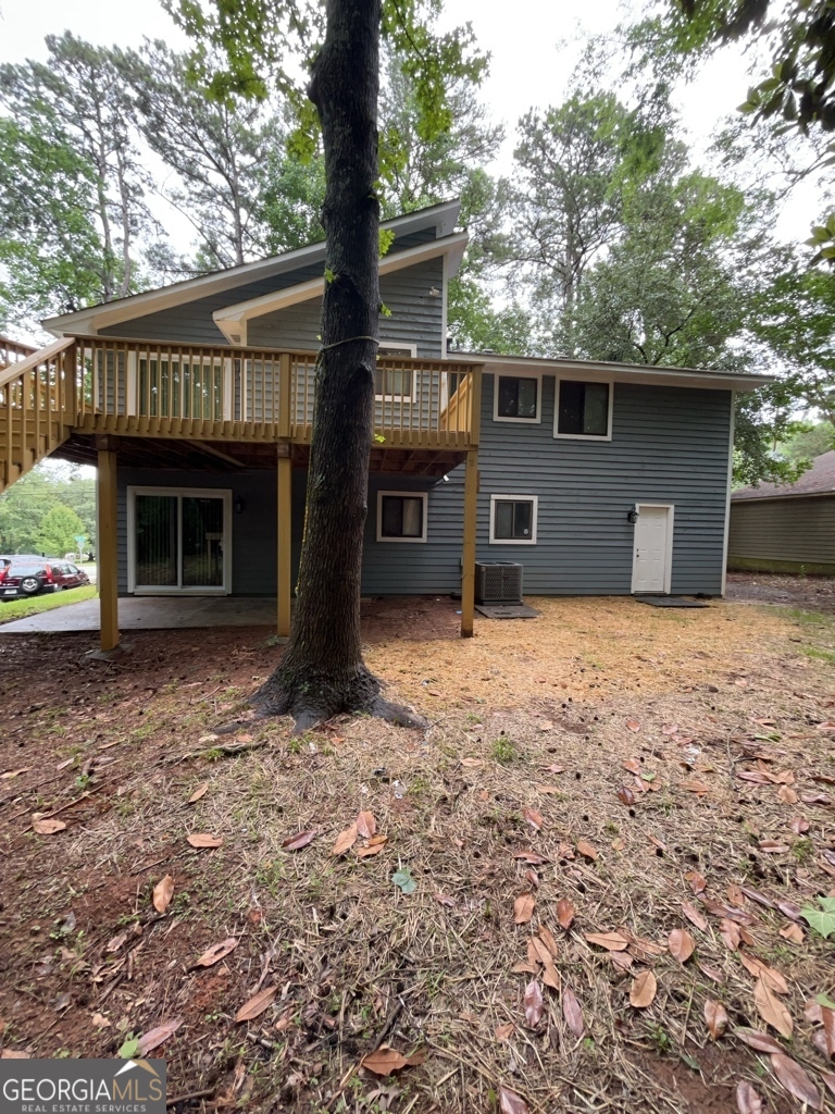1265 Herrington Road Lawrenceville, GA 30044 - Photo 52 of 52 a front view of a house with a yard and garage