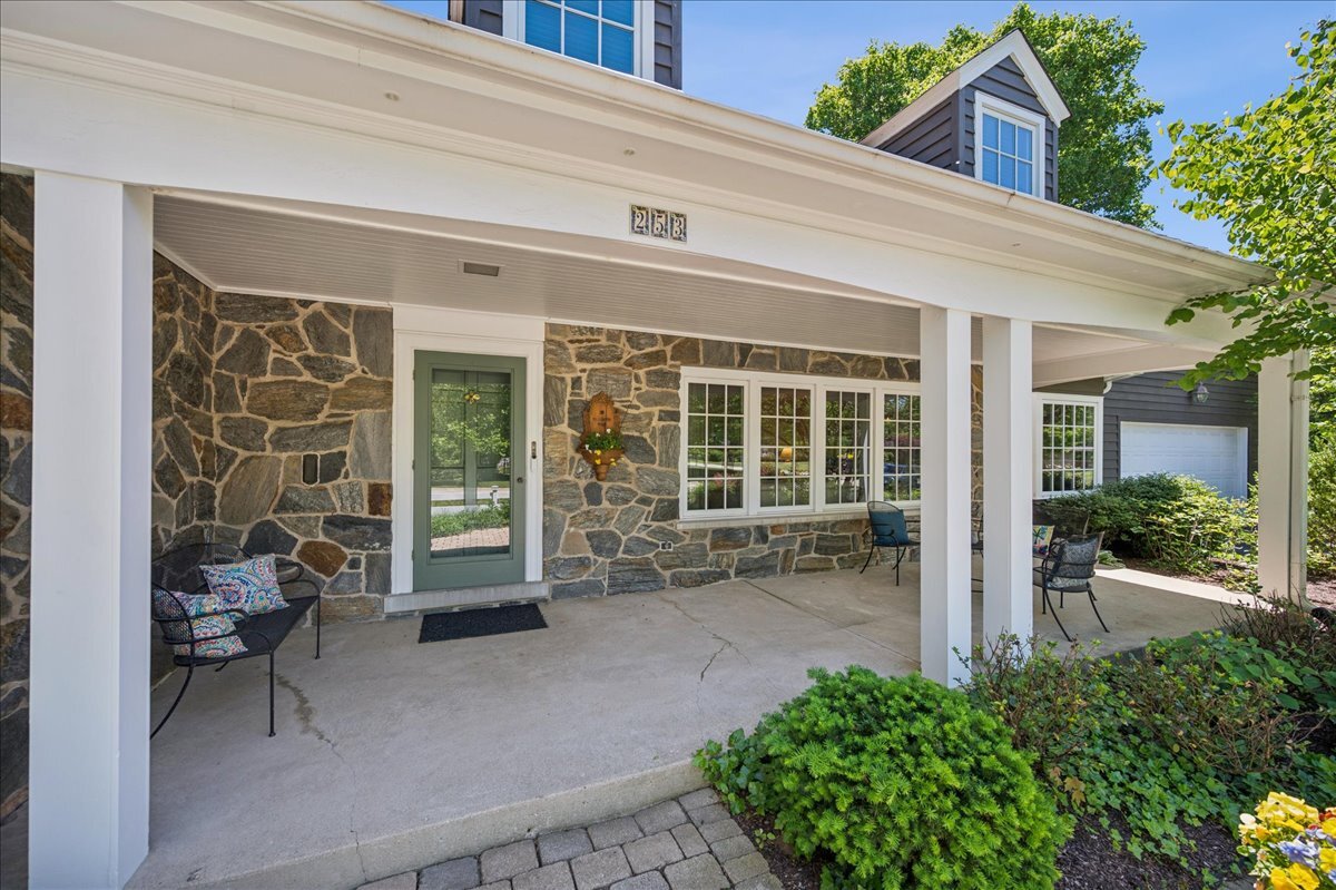 253 Summerfield Road Northbrook, IL 60062 - Photo 5 of 46 a view of a house with a large window and chair