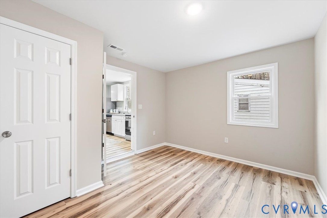1989 Cox Road Blackstone, VA 23824 - Photo 26 of 44 Empty room featuring light wood finished floors an