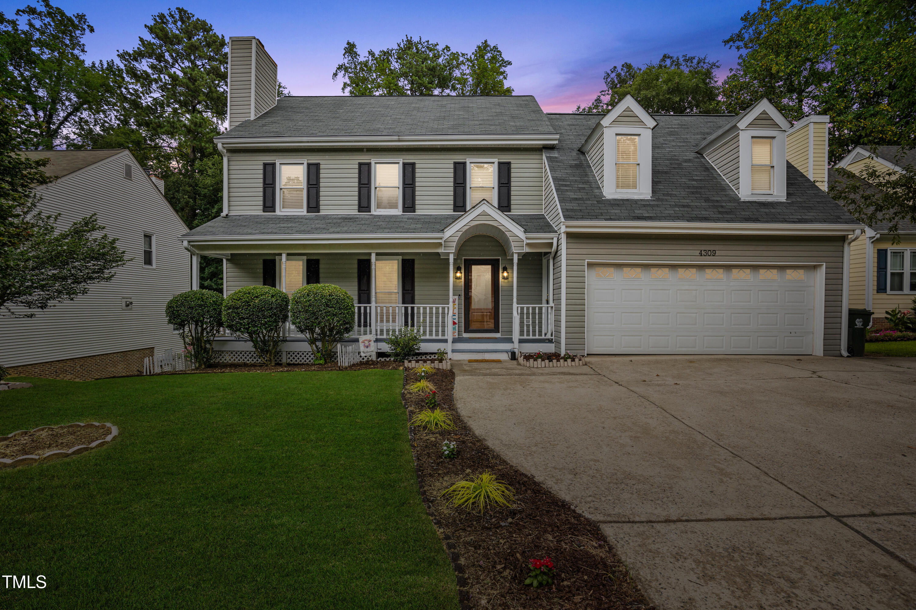 4309 Birmingham Way Raleigh, NC 27604 - Photo 1 of 60 a front view of a house with a garden and plants