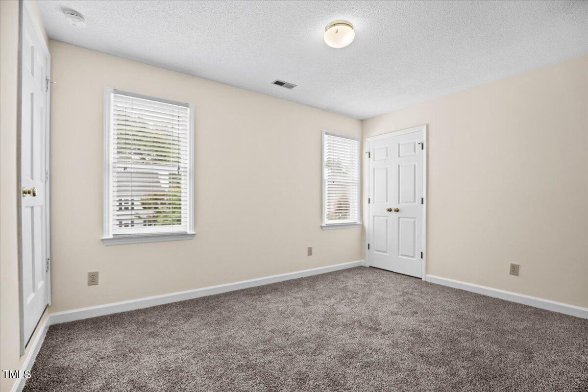 4309 Birmingham Way Raleigh, NC 27604 - Photo 24 of 60 a view of an empty room with a window