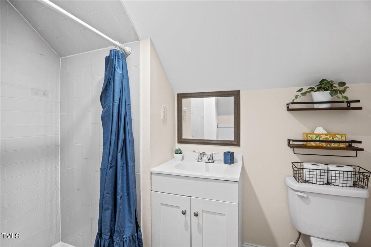 4309 Birmingham Way Raleigh, NC 27604 - Photo 43 of 60 a bathroom with a sink a toilet and a mirror