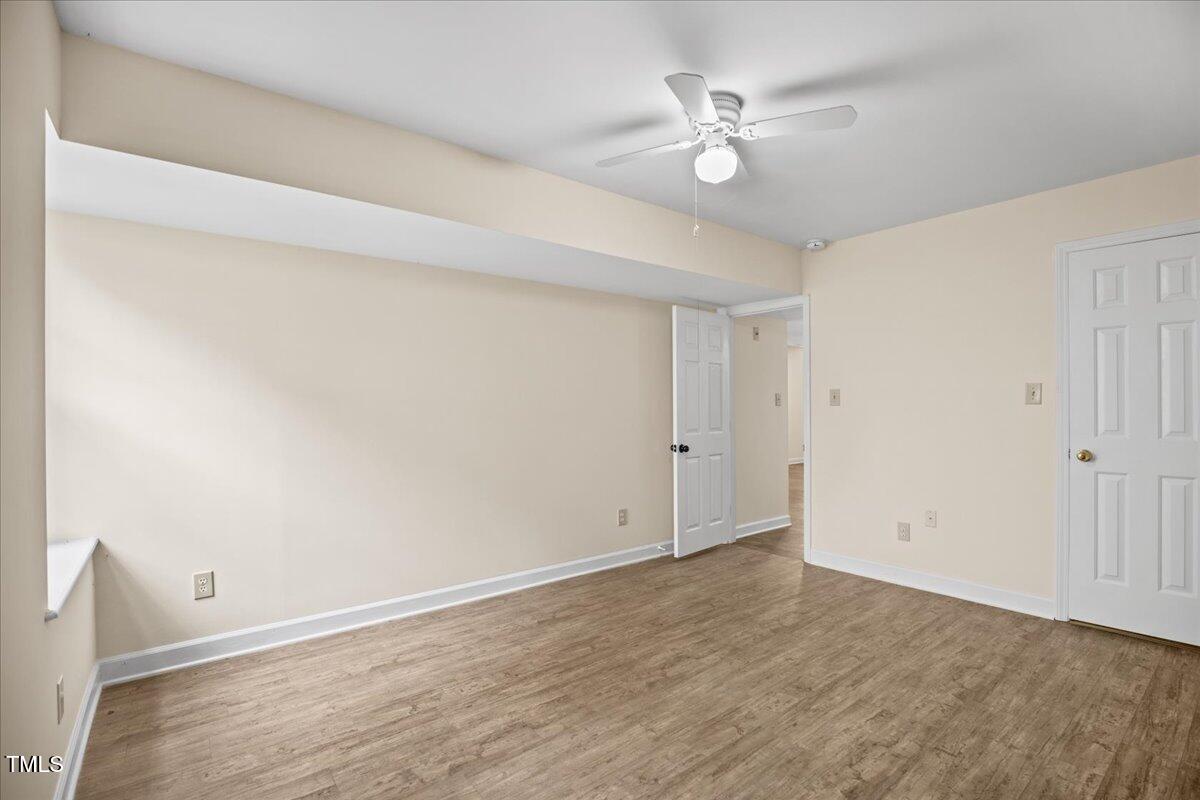 4309 Birmingham Way Raleigh, NC 27604 - Photo 45 of 60 an empty room with fan and a ceiling fan