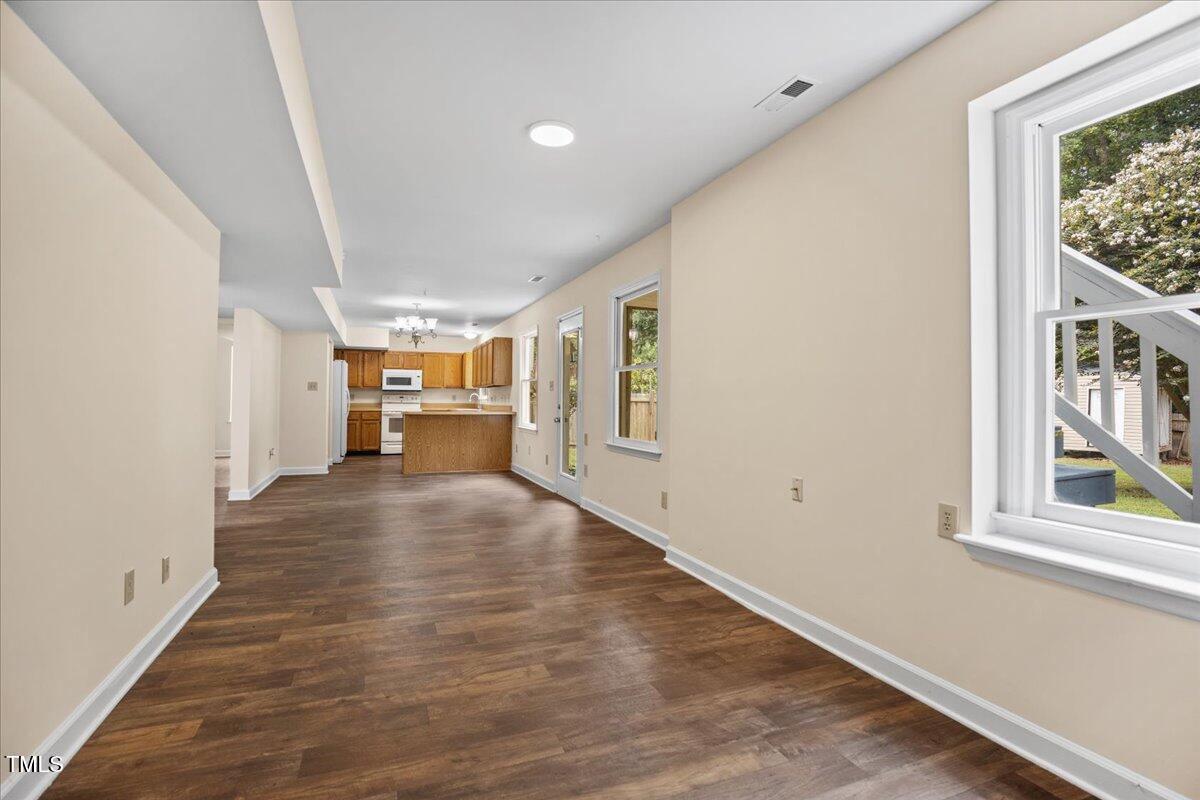 4309 Birmingham Way Raleigh, NC 27604 - Photo 46 of 60 a view of empty room with wooden floor and window