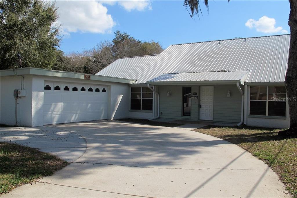 5418 Dartmouth Road New Port Richey, FL 34652 - Photo 1 of 1 a front view of a house with yard