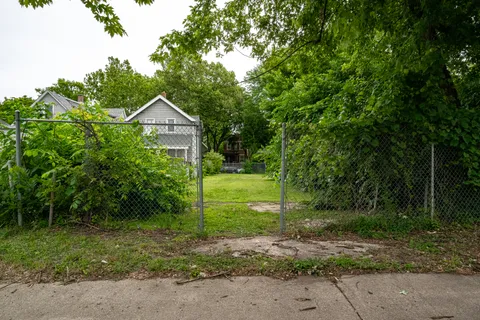 a view of a house with a small yard