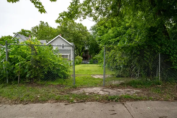 a view of a house with a small yard