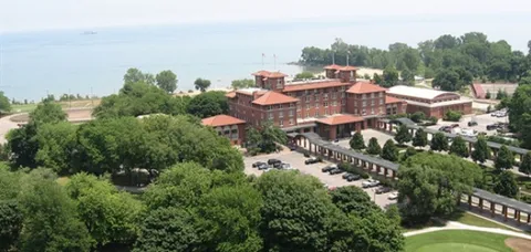 a view of a house with a yard and lake view