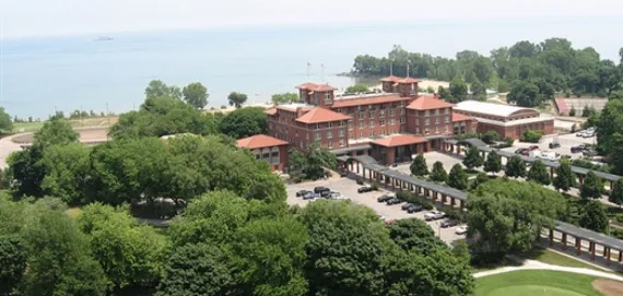 a view of a house with a yard and lake view