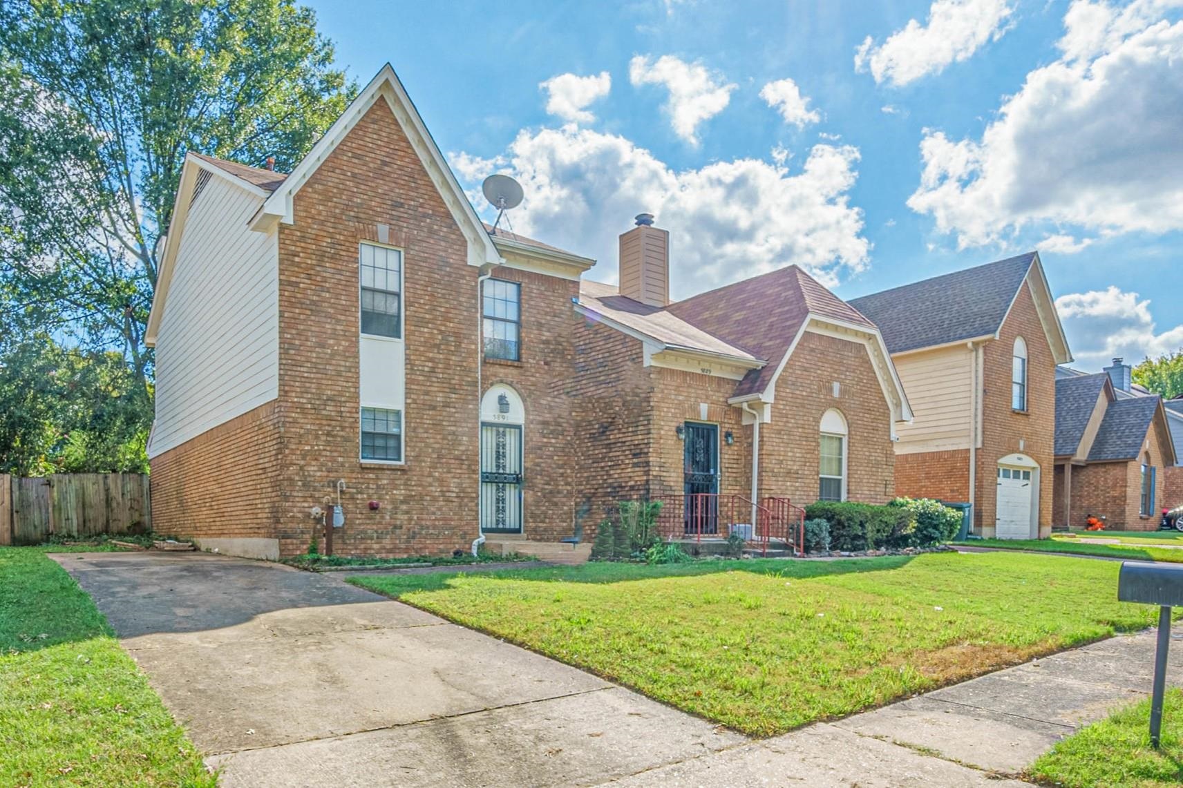 5891 Ridgehill Drive Memphis, TN 38141 - Photo 2 of 13 View of front property with a front yard