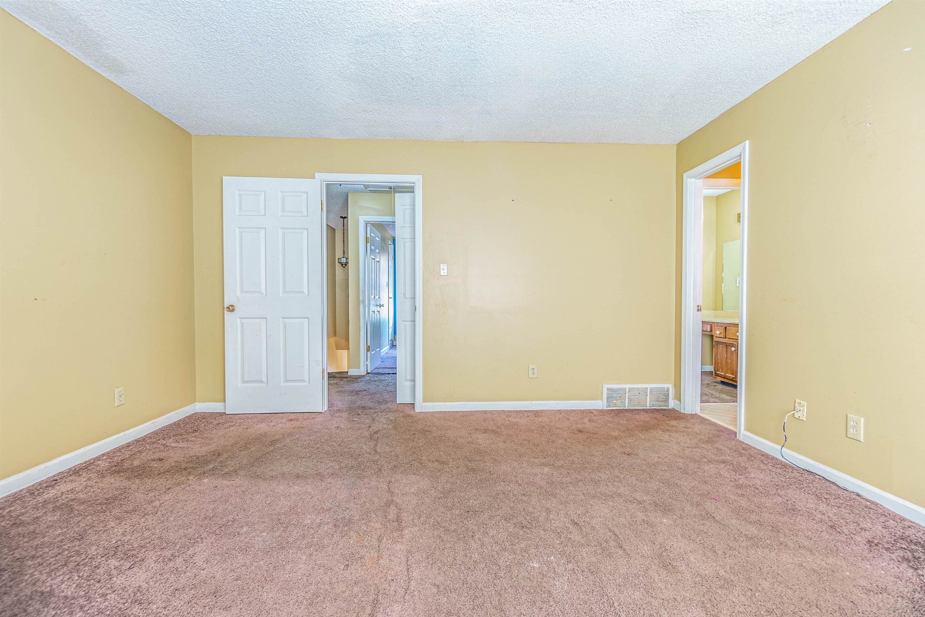5891 Ridgehill Drive Memphis, TN 38141 - Photo 10 of 13 Unfurnished room with a textured ceiling and carpet