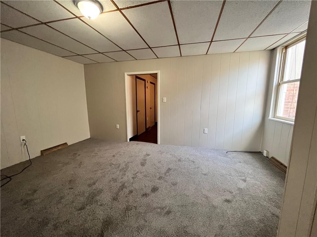 507 Harmony Avenue, Unit 1R Rochester, PA 15074 - Photo 8 of 18 a view of a livingroom with an empty space and a window