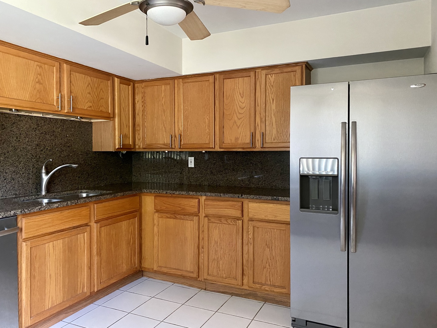 19398 Wolf Road, Unit 3 Mokena, IL 60448 - Photo 2 of 7 a kitchen with stainless steel appliances granite countertop a refrigerator a sink and dishwasher