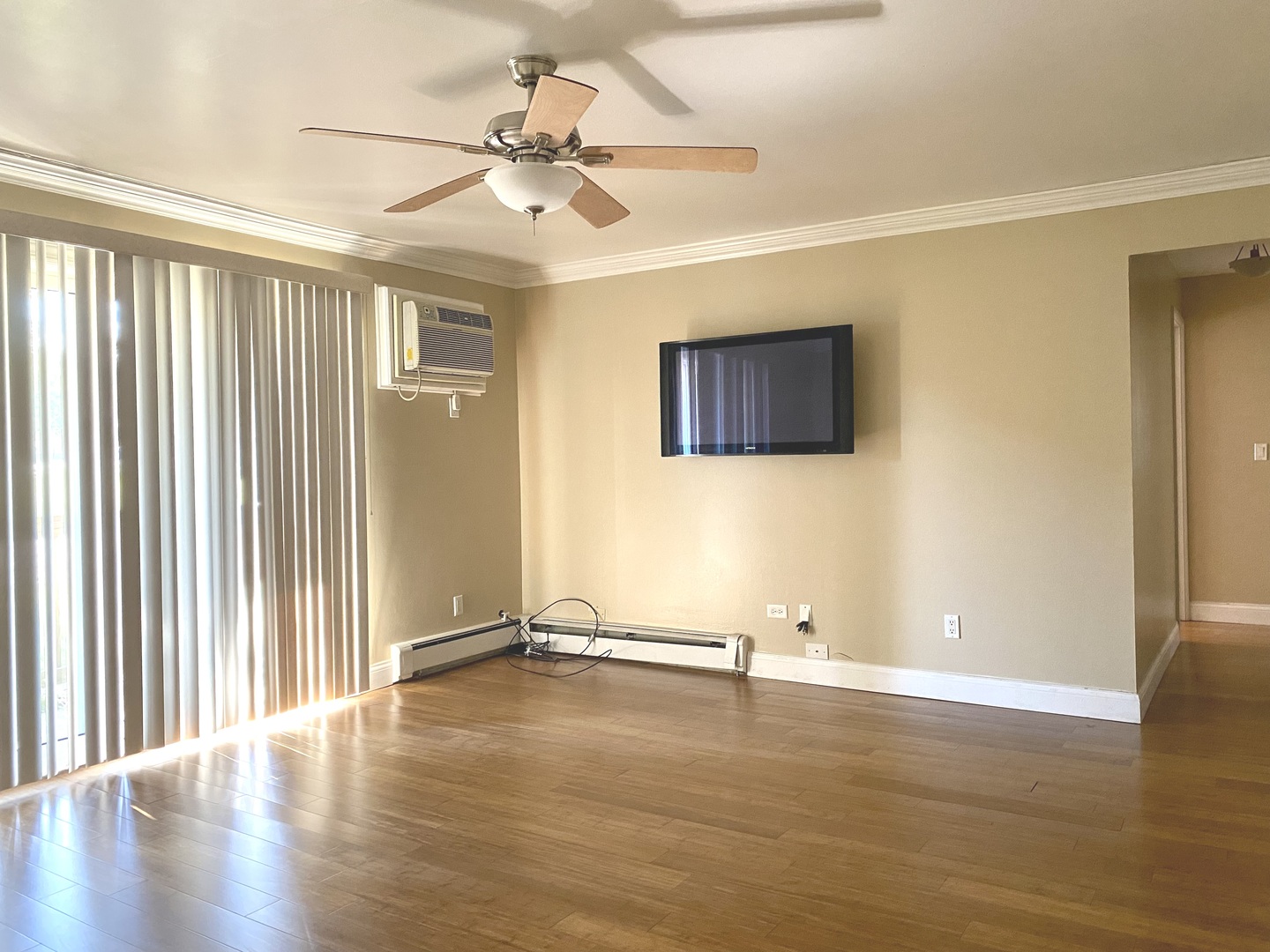 19398 Wolf Road, Unit 3 Mokena, IL 60448 - Photo 4 of 7 wooden floor in an empty room with a window