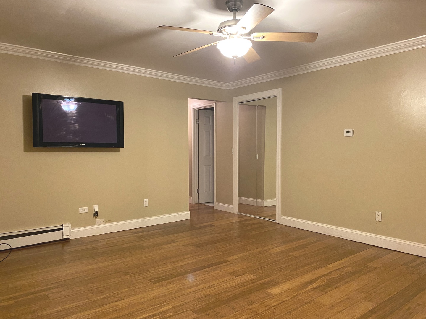19398 Wolf Road, Unit 3 Mokena, IL 60448 - Photo 5 of 7 an empty room with wooden floor and windows