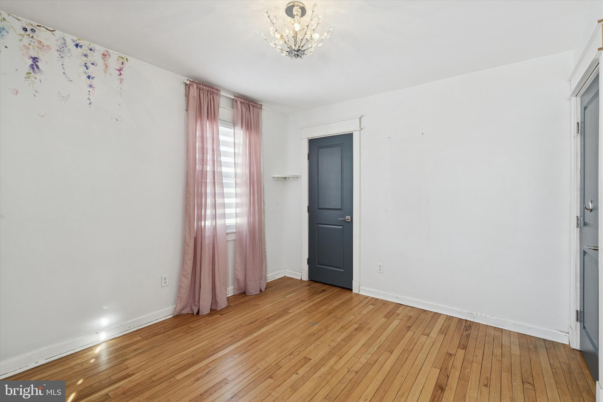 6 Cedar Road Wallingford, PA 19086 - Photo 21 of 36 a view of empty room with wooden floor and fan