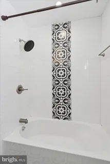 a bathroom with a shower and a shower