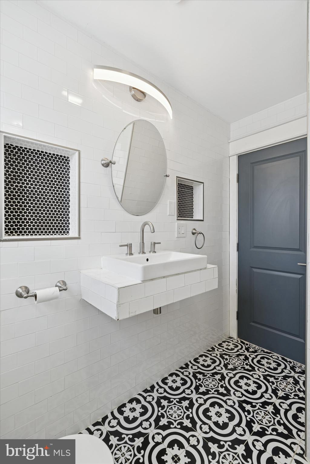 6 Cedar Road Wallingford, PA 19086 - Photo 23 of 36 a bathroom with a sink and a mirror