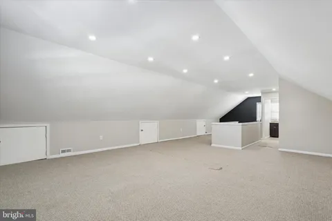 an empty room with table and window