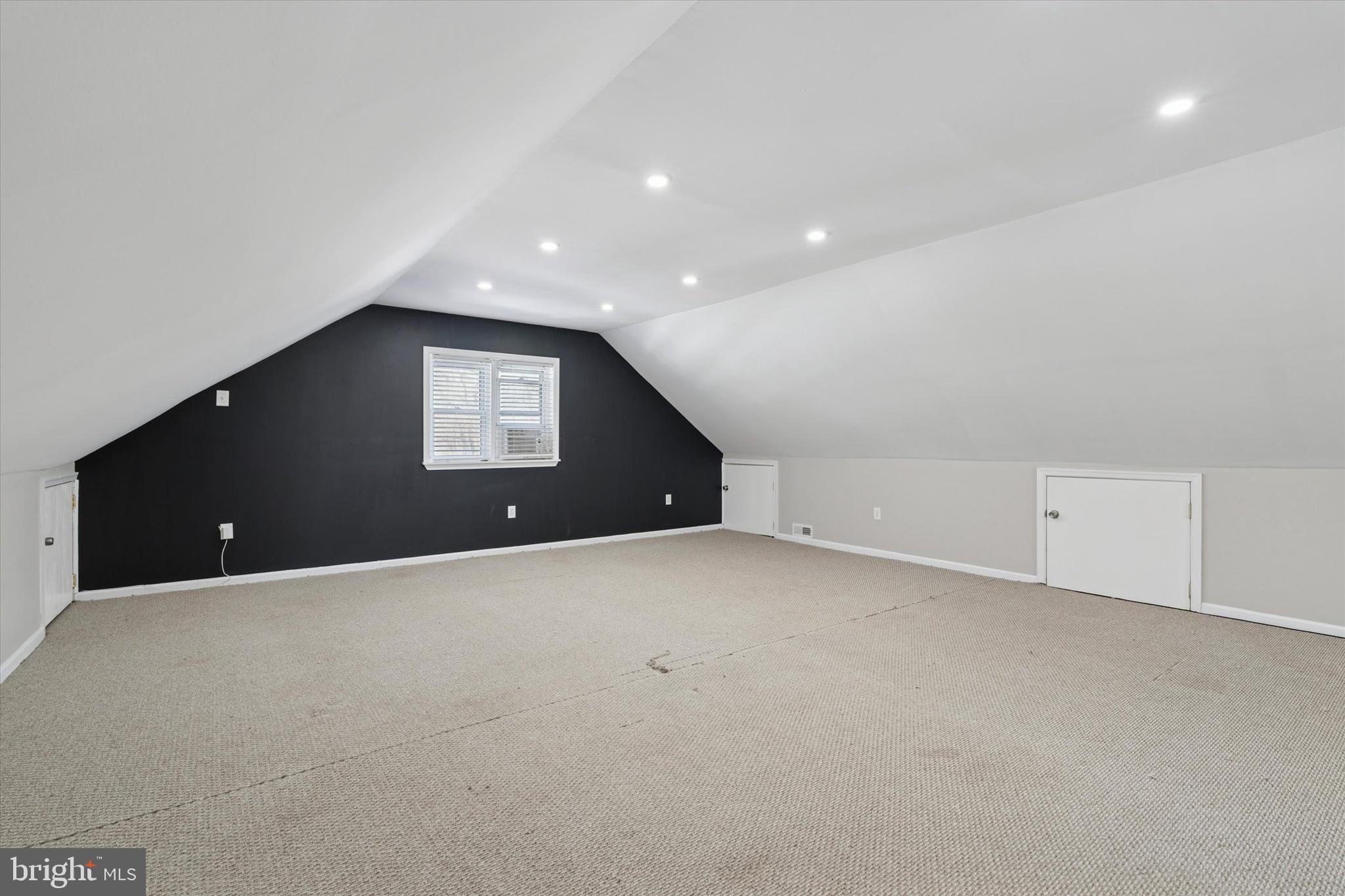 6 Cedar Road Wallingford, PA 19086 - Photo 26 of 36 a view of an empty room with a window and fireplace