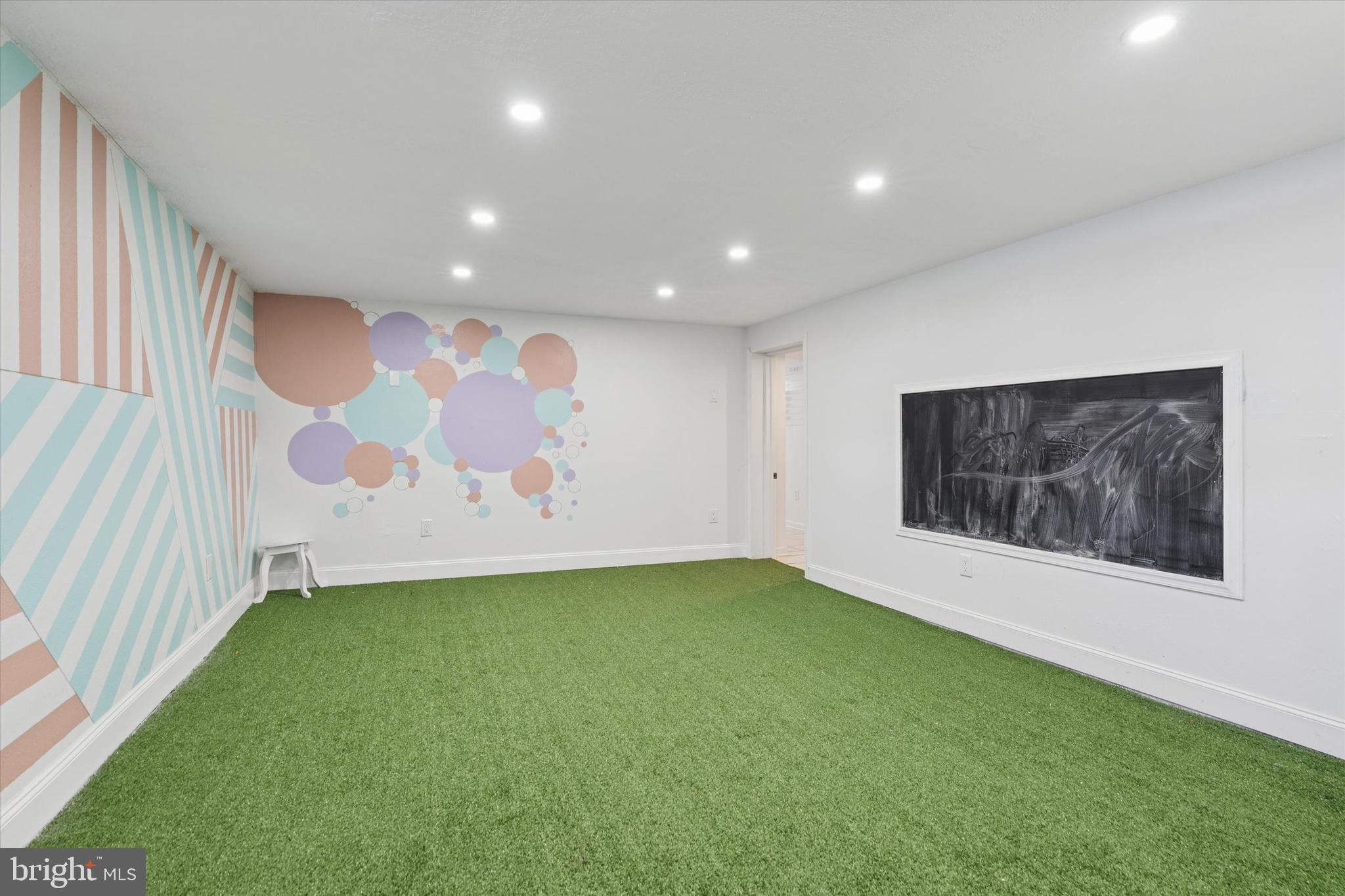 6 Cedar Road Wallingford, PA 19086 - Photo 28 of 36 a view of an empty room with a window and a kitchen