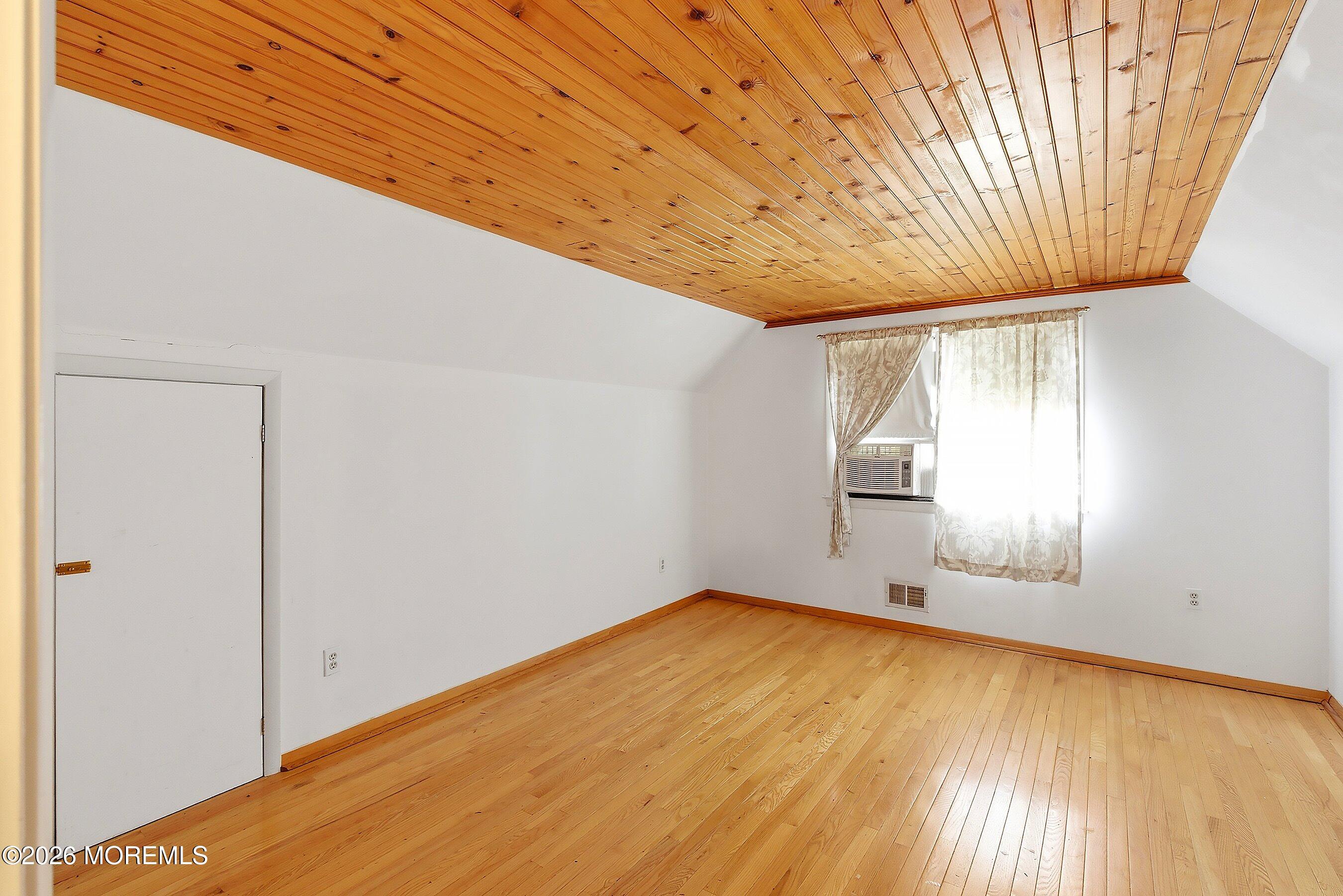 464 Newport Road Forked River, NJ 08731 - Photo 14 of 23 a view of empty room with wooden floor and fan