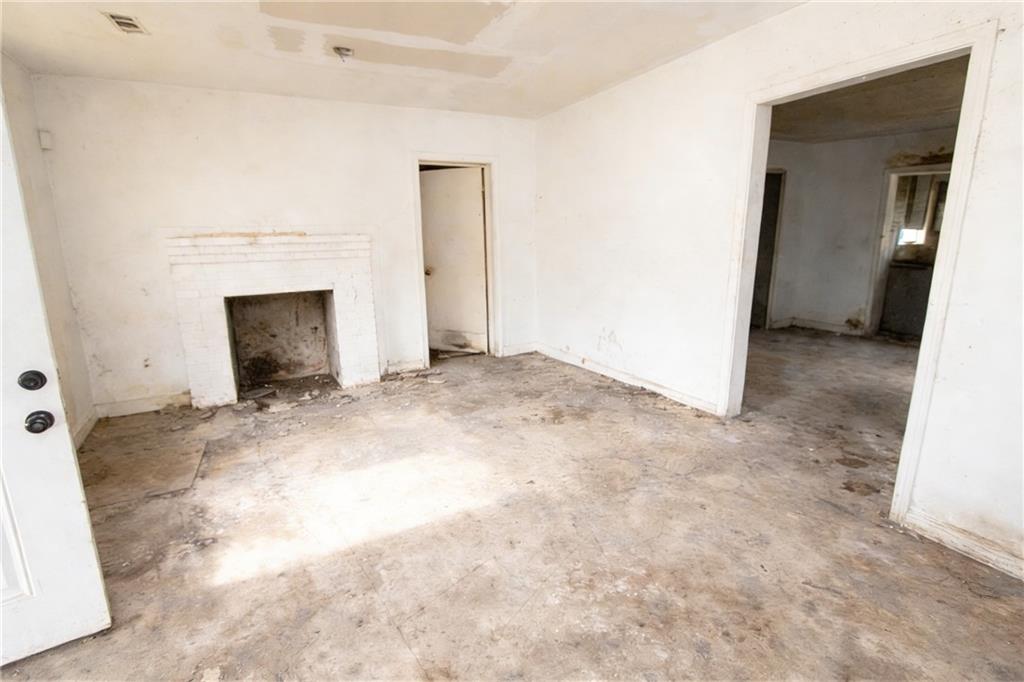 731 Bolton Road Northwest Atlanta, GA 30331 - Photo 17 of 20 a view of an empty room with a fireplace