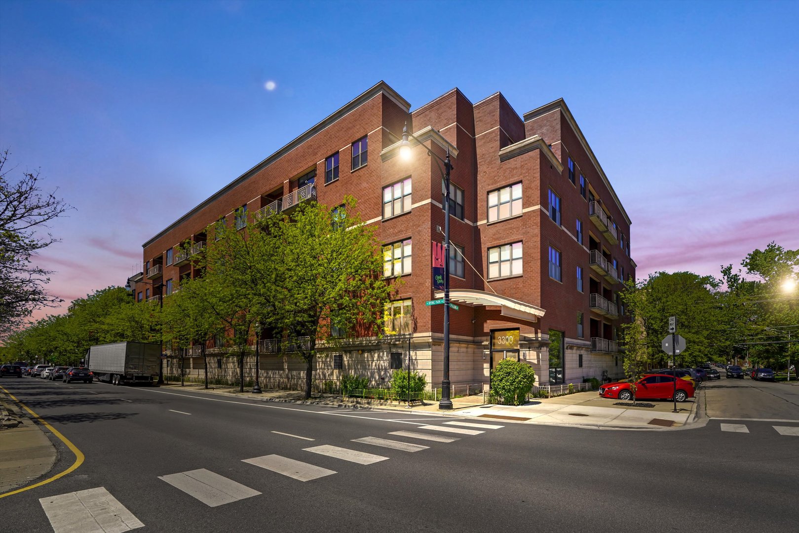 3300 West Irving Park Road, Unit F4 Chicago, IL 60618 - Photo 1 of 1 a view of a street with a building in the background