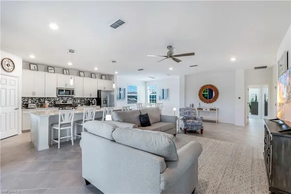 a spacious bedroom with a bed and a window