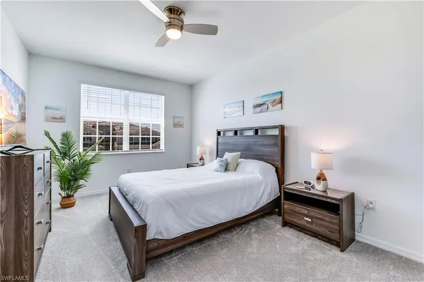 a spacious bathroom with a shower sink and mirror