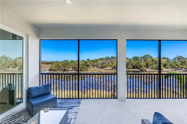 a view of a balcony with furniture
