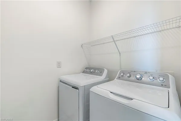 a view of a swimming pool with a patio and a garden